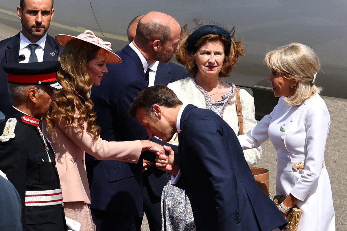 Emmanuel Macron greets Princess Kate with kiss on hand as he lands for state visit