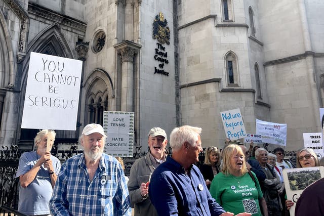 Protesters outside the Royal Courts of Justice, central London, where The Save Wimbledon Park group is taking action against the Greater London Authority (GLA) over its decision to grant planning permission for the All England Lawn Tennis Club’s expansion of the Wimbledon site onto neighbouring golf course in Wimbledon Park, adding an 8,000-seat stadium and 38 new championship-sized courts (Callum Parke/PA)