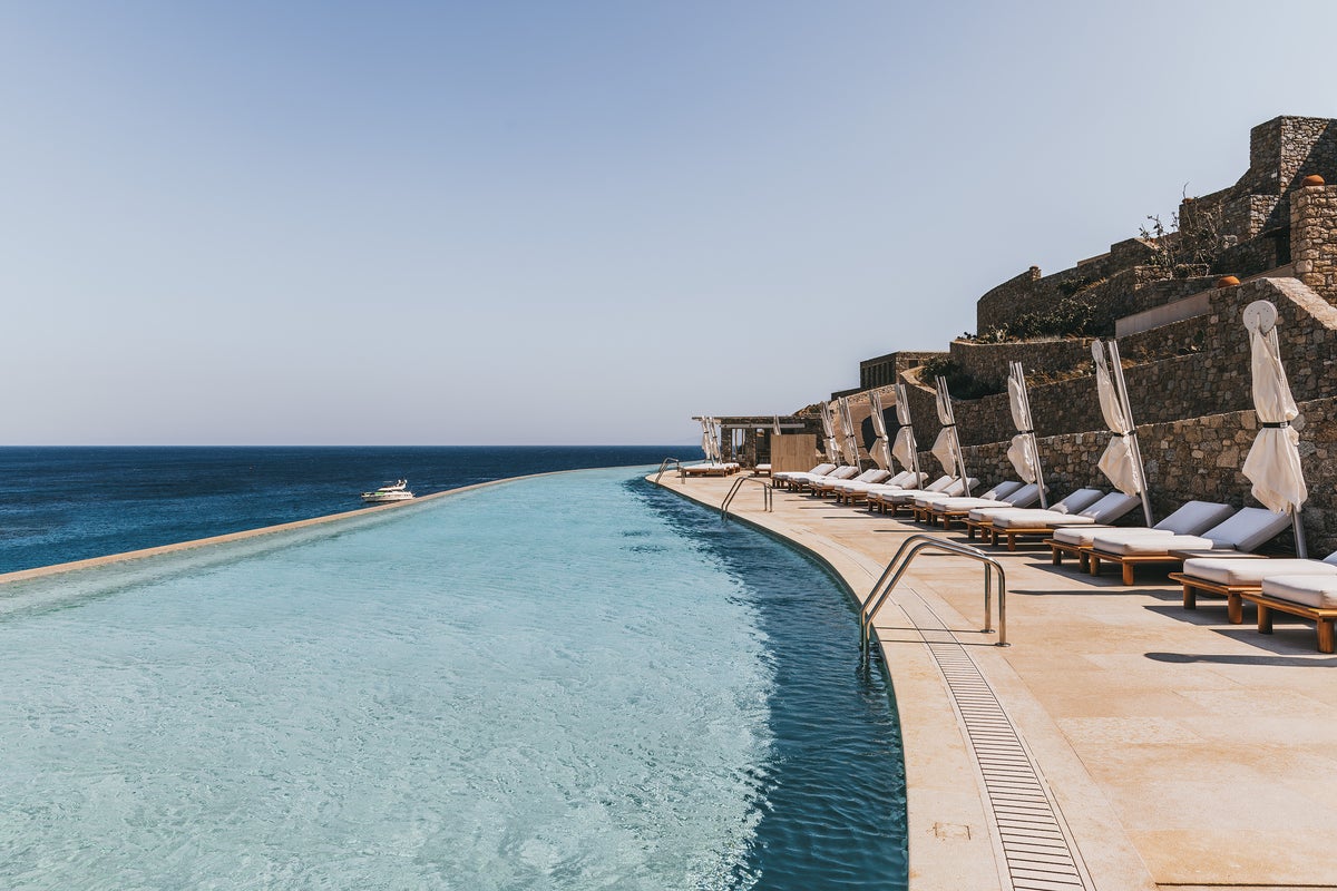 From Lake Garda to the Savannah, these are the world’s best hotels with swimming pools