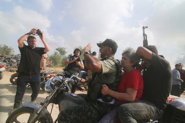 <p>Hamas militants transport Adina Moshe, 72, inside the Gaza Strip after kidnapping her from her home in Nir Oz, a kibbutz in Israel near the Gaza border, on 7 October 2023</p>