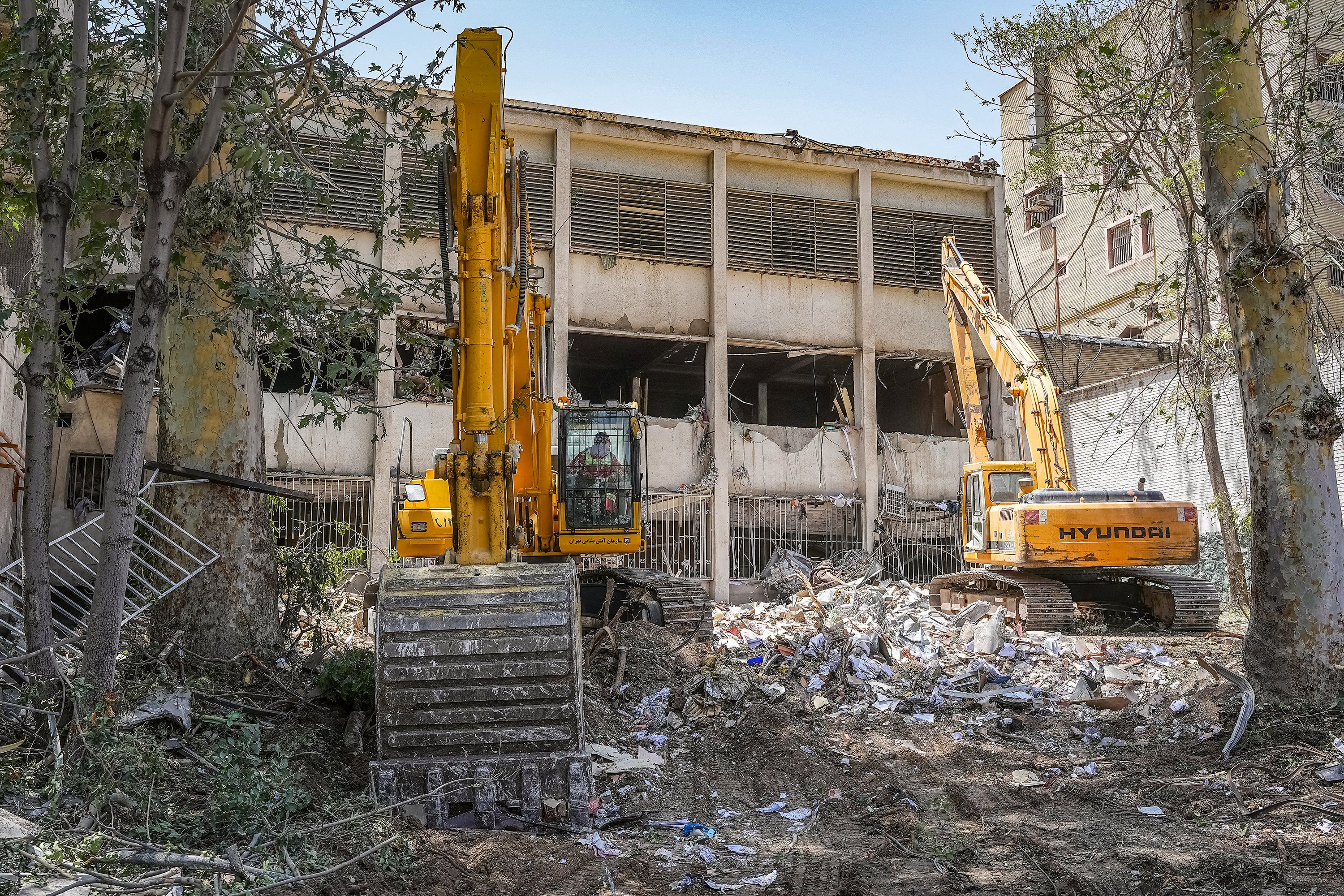 Rubble outside the Evin prison complex following an Israeli strike during the war last summer