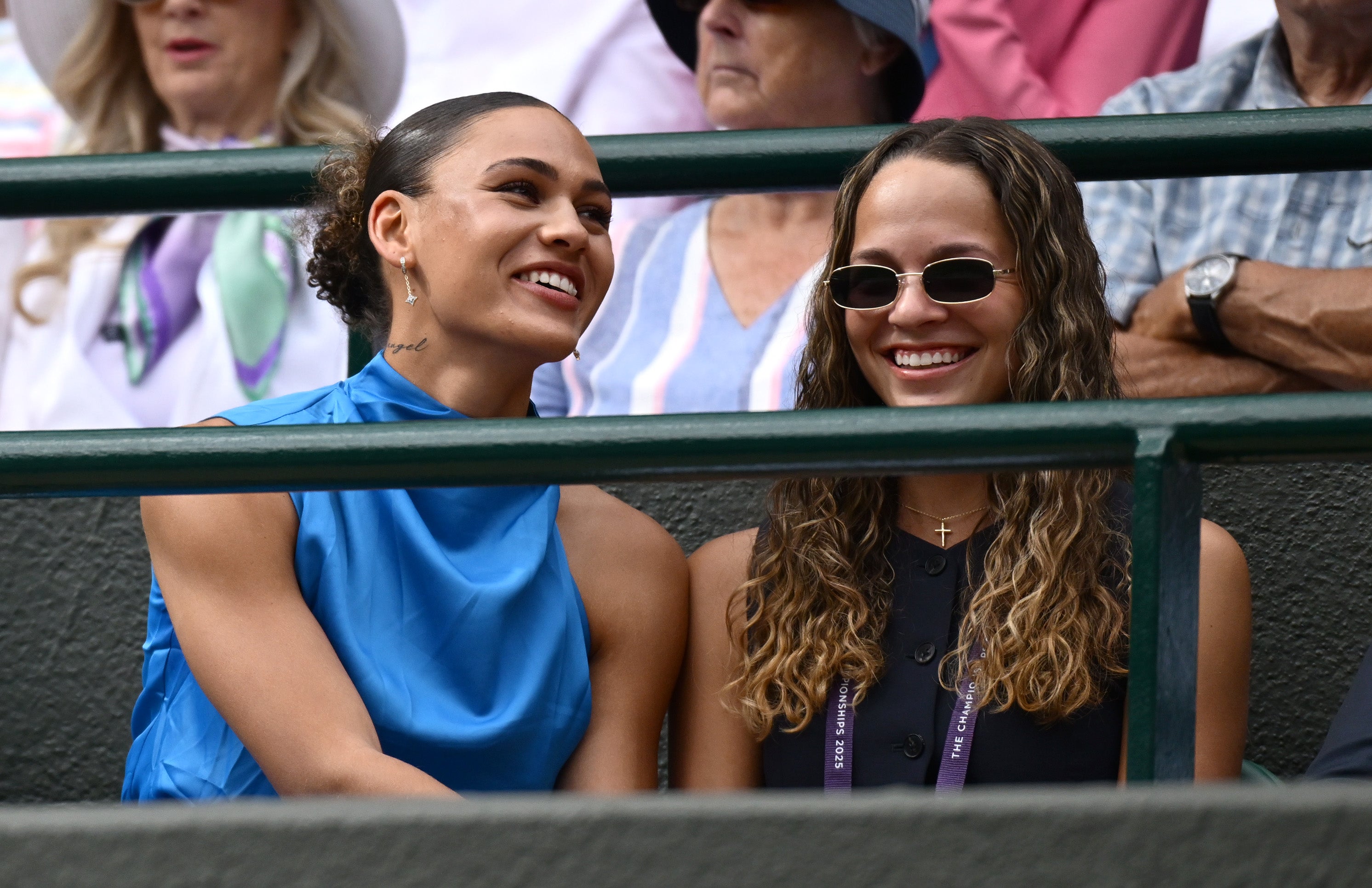 Trinity (left) was cheering on her boyfriend at Wimbledon alongside his family