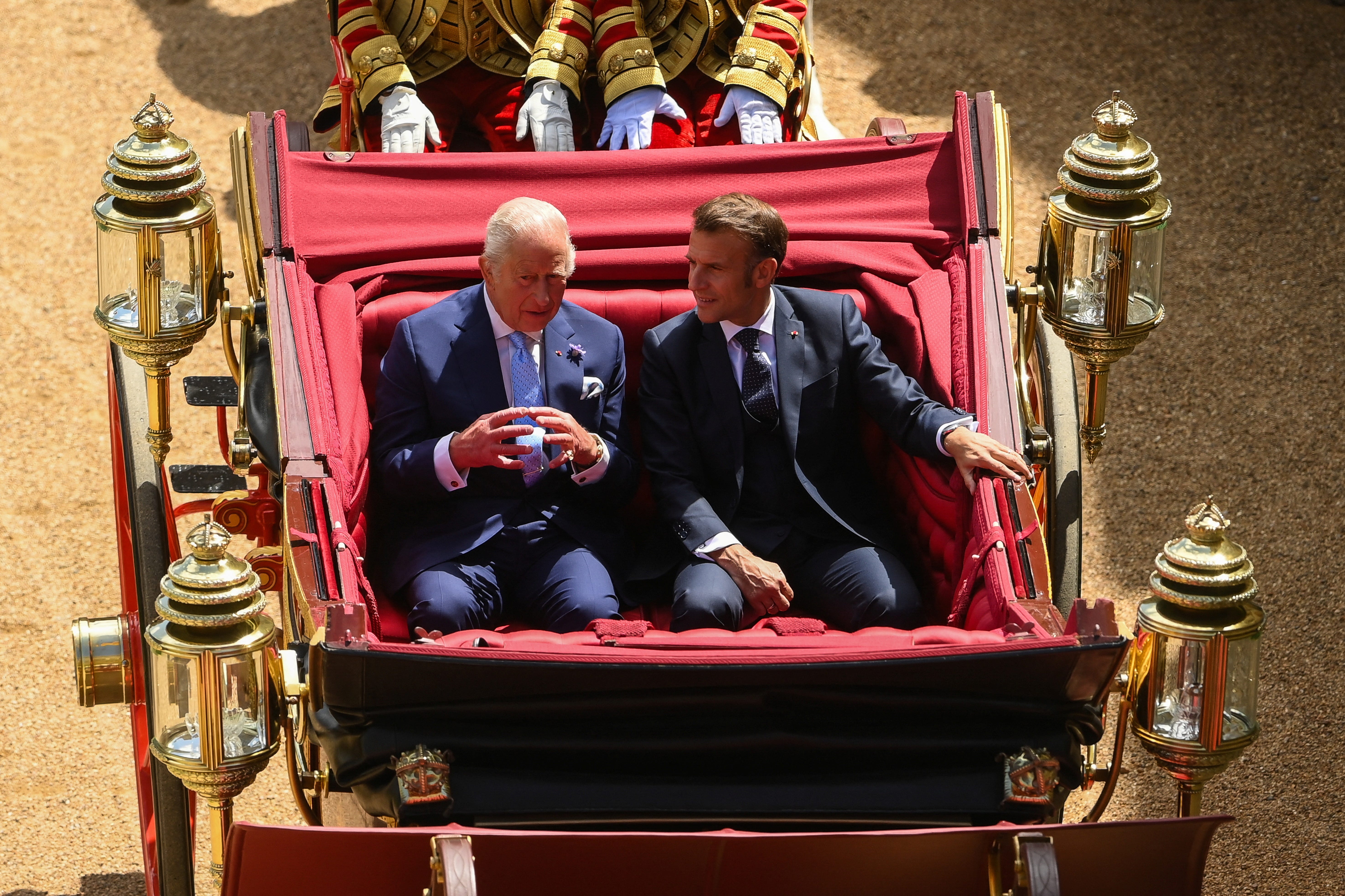 The King and President of France Emmanuel Macron arrive for the ceremonial welcome for the state visit to the UK of President Macron and his wife Brigitte Macron, at Windsor Castle, Berkshire (Jaimi Joy/PA)