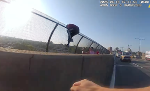 Moment NYPD officer races to grab woman trying to jump off bridge