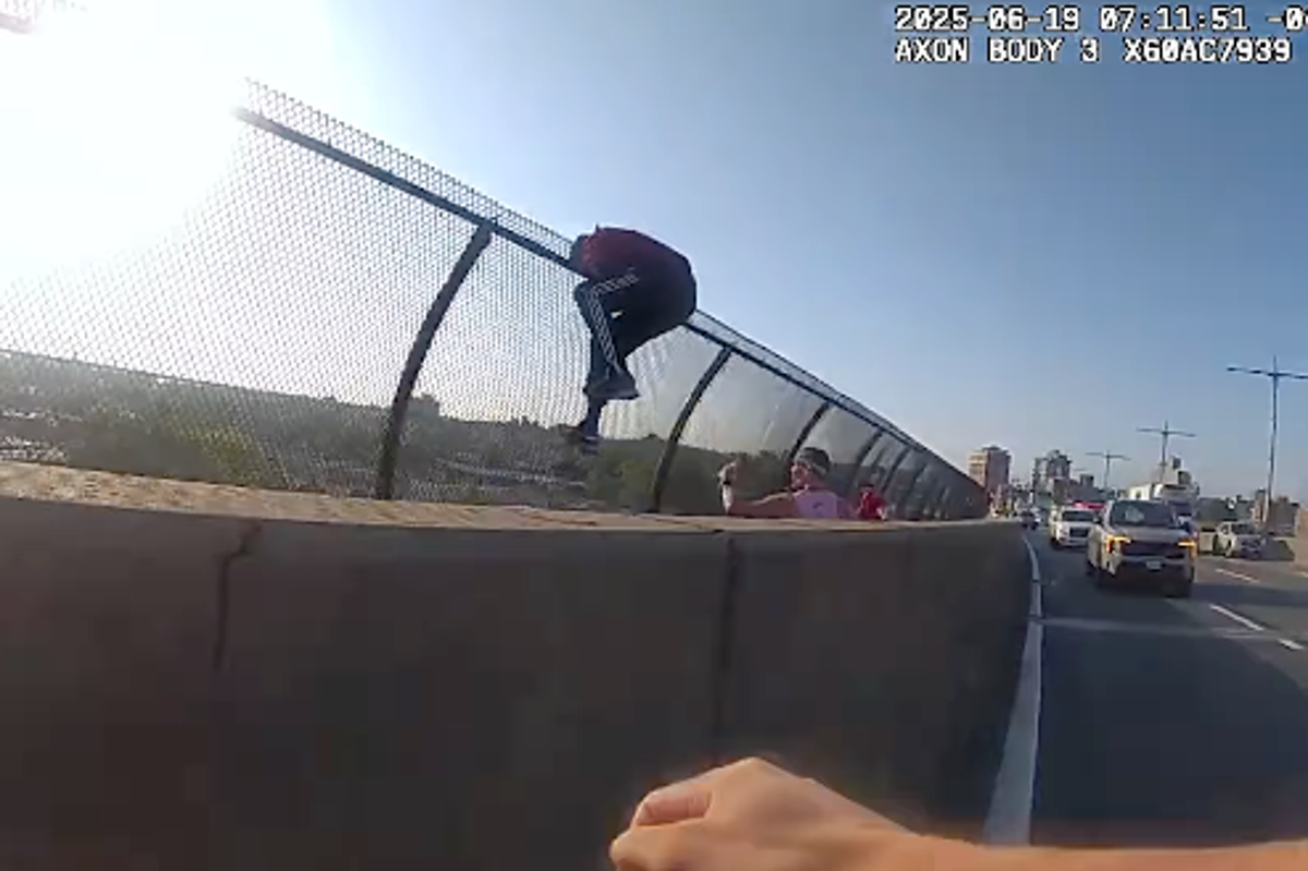 Heart-stopping moment NYPD officer races to grab woman trying to jump off bridge