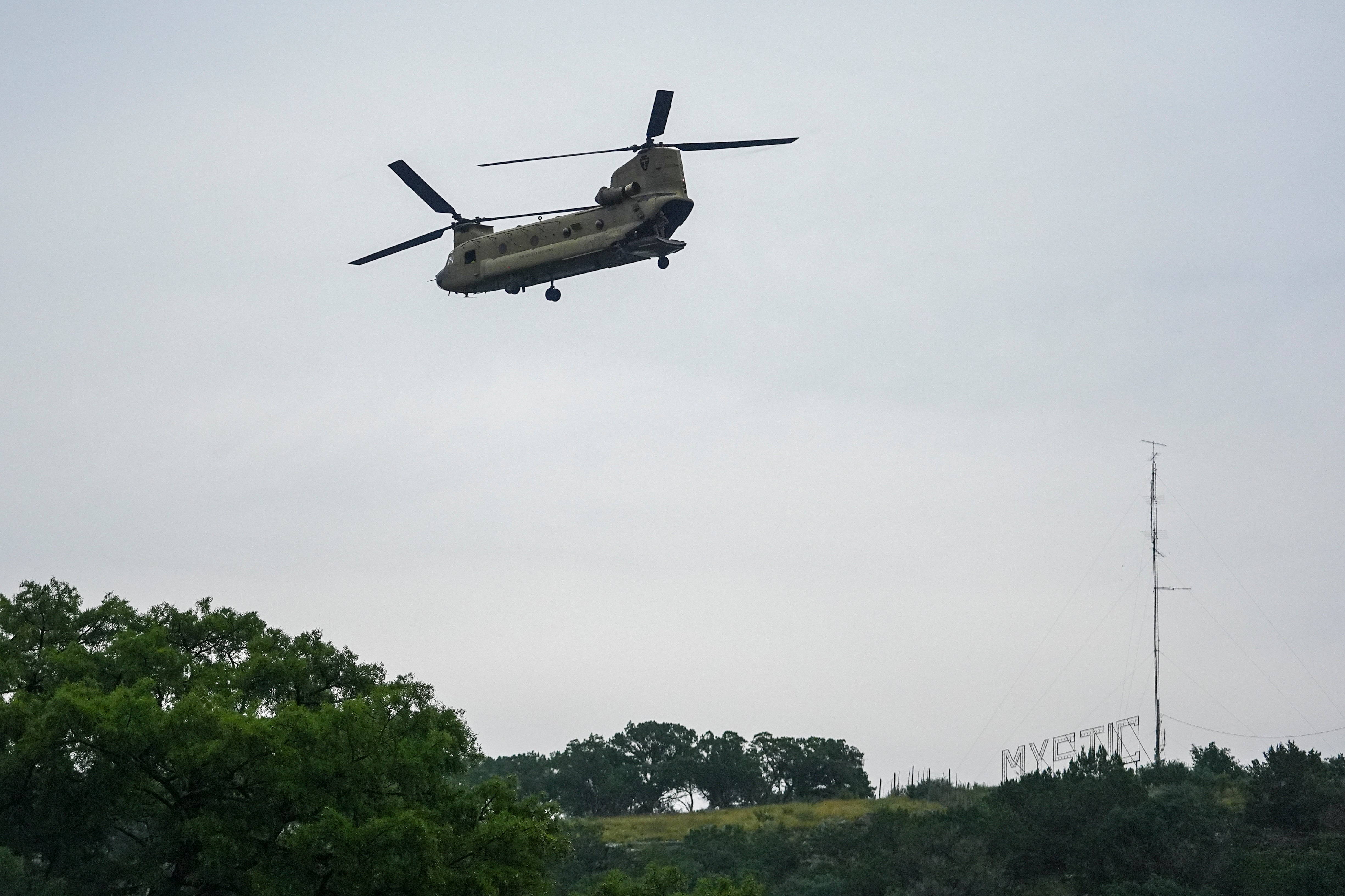 Heavy-lift military helicopter flies by over the Guadalupe River