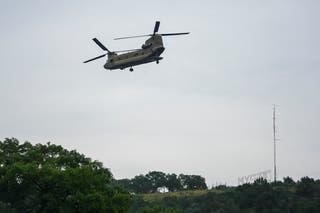 Heavy-lift military helicopter flies by over the Guadalupe River