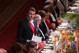 French President Emmanuel Macron speaks at dinner