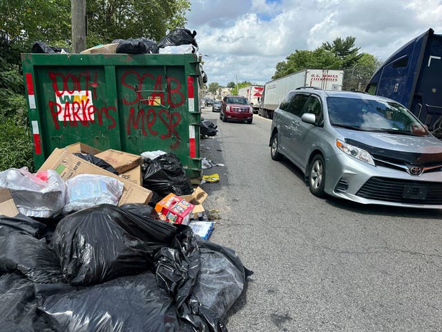 <p>Trash piles up around dumpsters in Philadelphia as thousands of city workers remained on strike Monday</p>