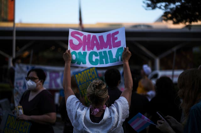 <p>Protesters hold signs while demonstrating against the closure of the trans youth clinic at Children's Hospital Los Angeles, Thursday, July 3, 2025, in Los Angeles. (AP Photo/Jae C. Hong)</p>
