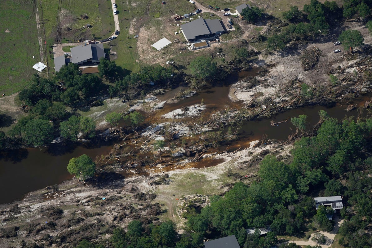 Searchers in helicopters and on horseback scour Texas flood debris for the missing