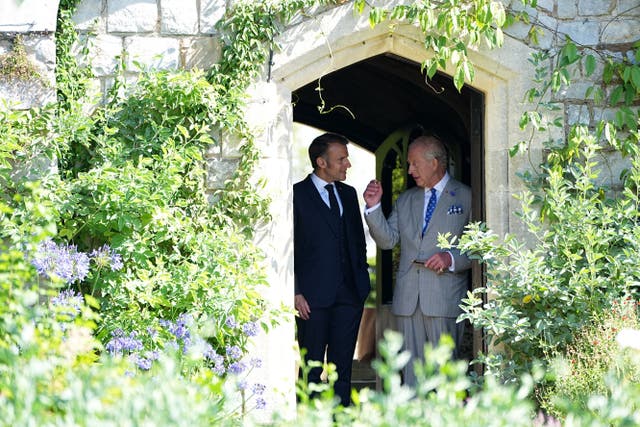 <p>France's President Emmanuel Macron (L) and Britain's King Charles III visit the gardens of Windsor Castle, west of London, on July 9, 2025, on the second day of a three-day state visit to Britain. King Charles III and Emmanuel Macron both hailed the importance of UK-France relations as the French president paid a three-day formal visit to Britain, the first by an EU head of state since Brexit. (Photo by Aaron Chown / POOL / AFP) (Photo by AARON CHOWN/POOL/AFP via Getty Images)</p>
