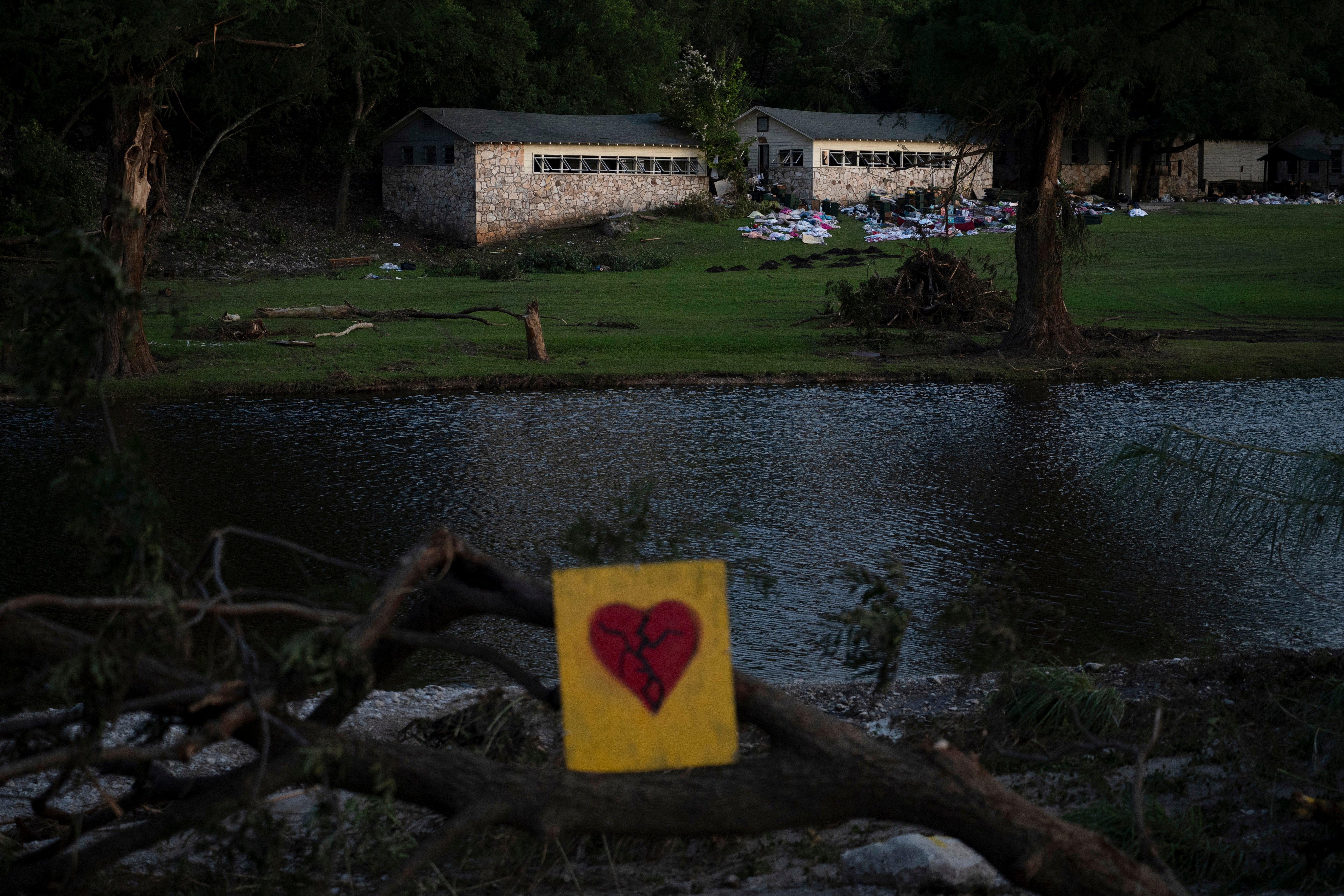 A broken heart sign is displayed near Camp Mystic on Tuesday, July 8