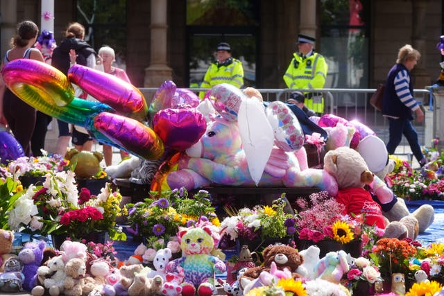 <p>Flowers and tributes were left outside the Atkinson Art Centre Southport following the attack in July last year (Owen Humphreys/PA)</p>