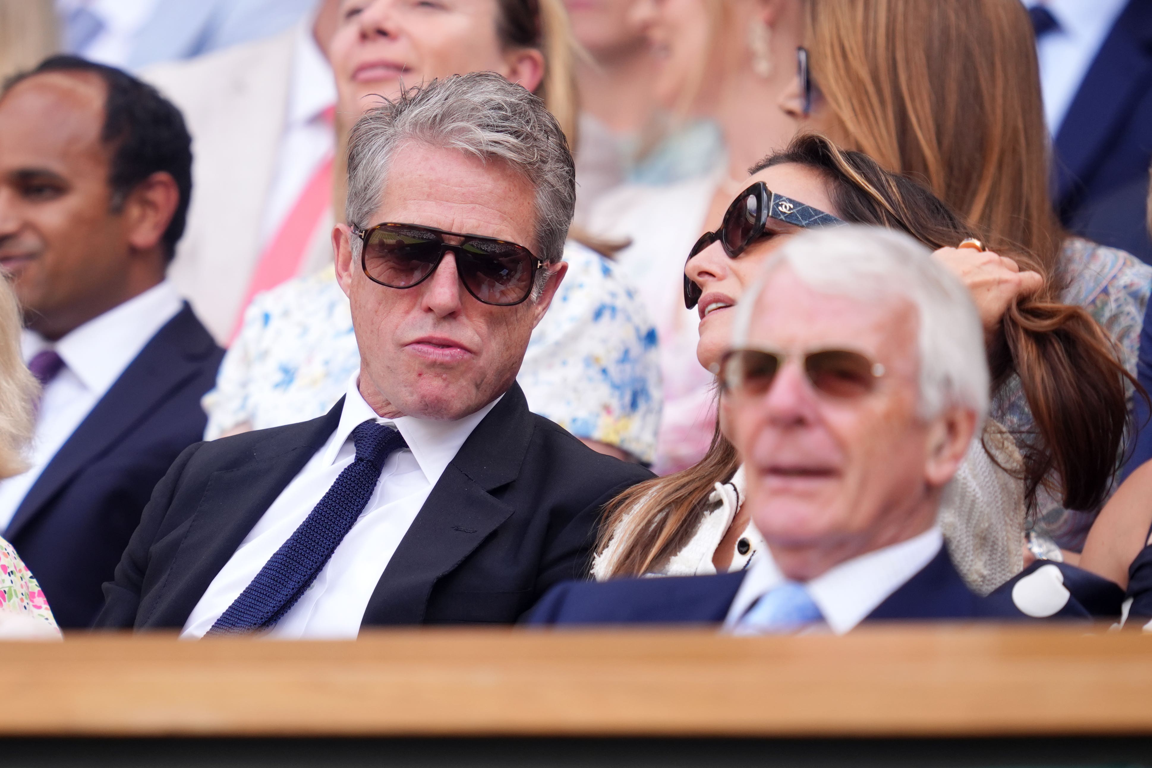 Hugh Grant, left, alongside Sir John Major in the Royal Box on day 10 of Wimbledon (Adam Davy/PA)
