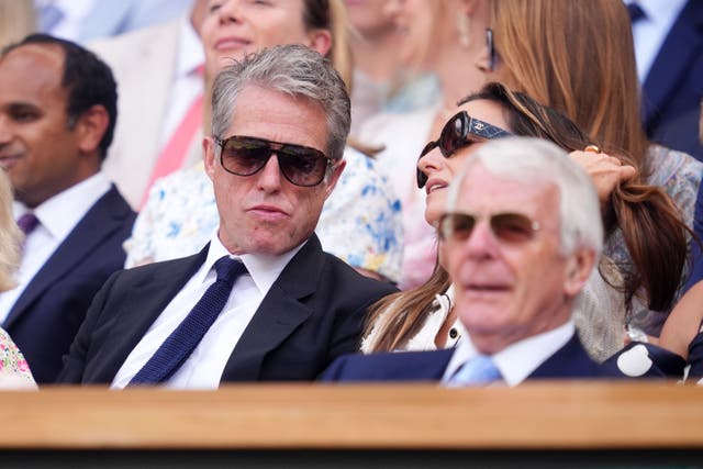 Hugh Grant, left, alongside Sir John Major in the Royal Box on day 10 of Wimbledon (Adam Davy/PA)