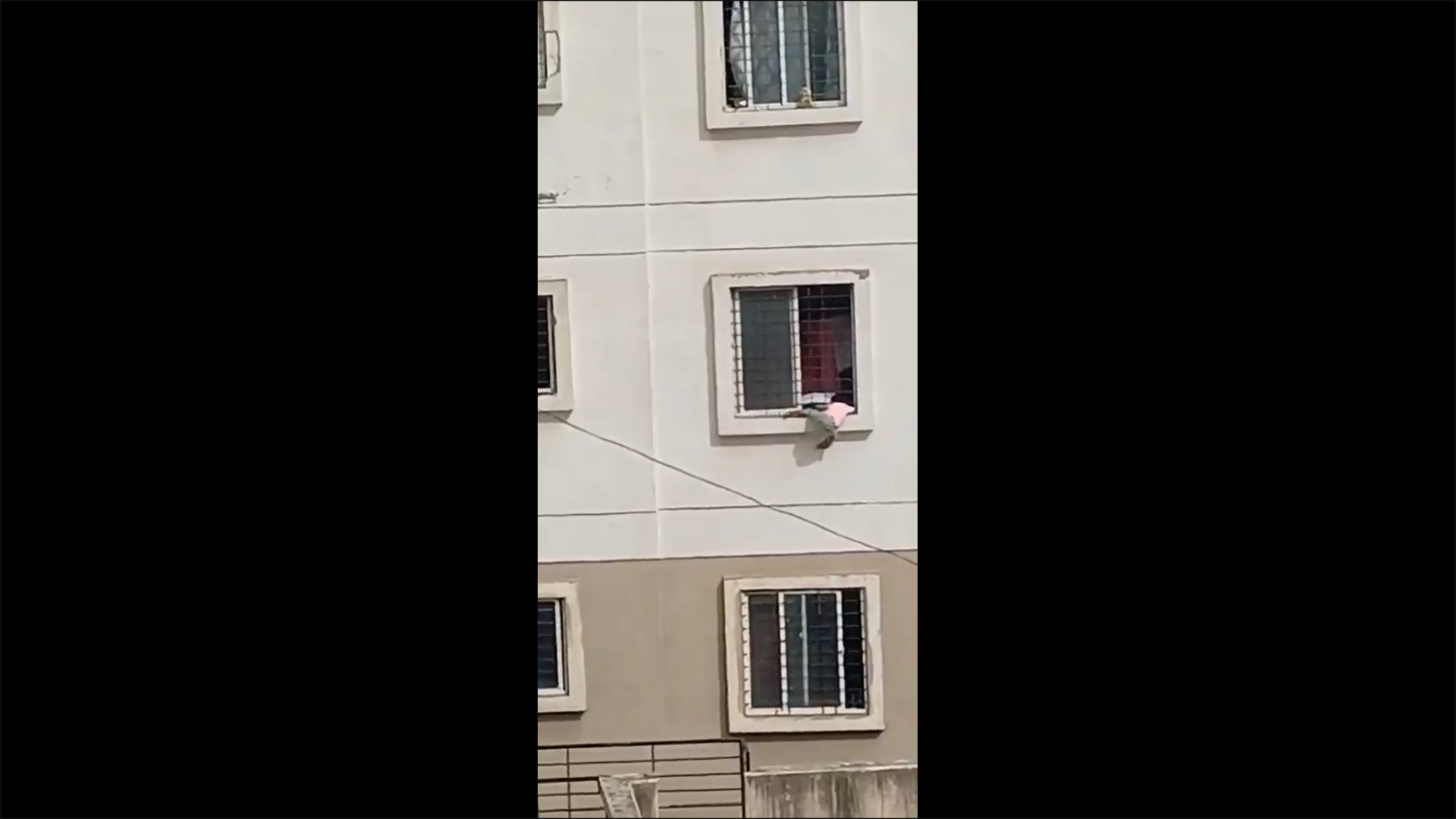 <p>Girl dangling from window is rescued</p>