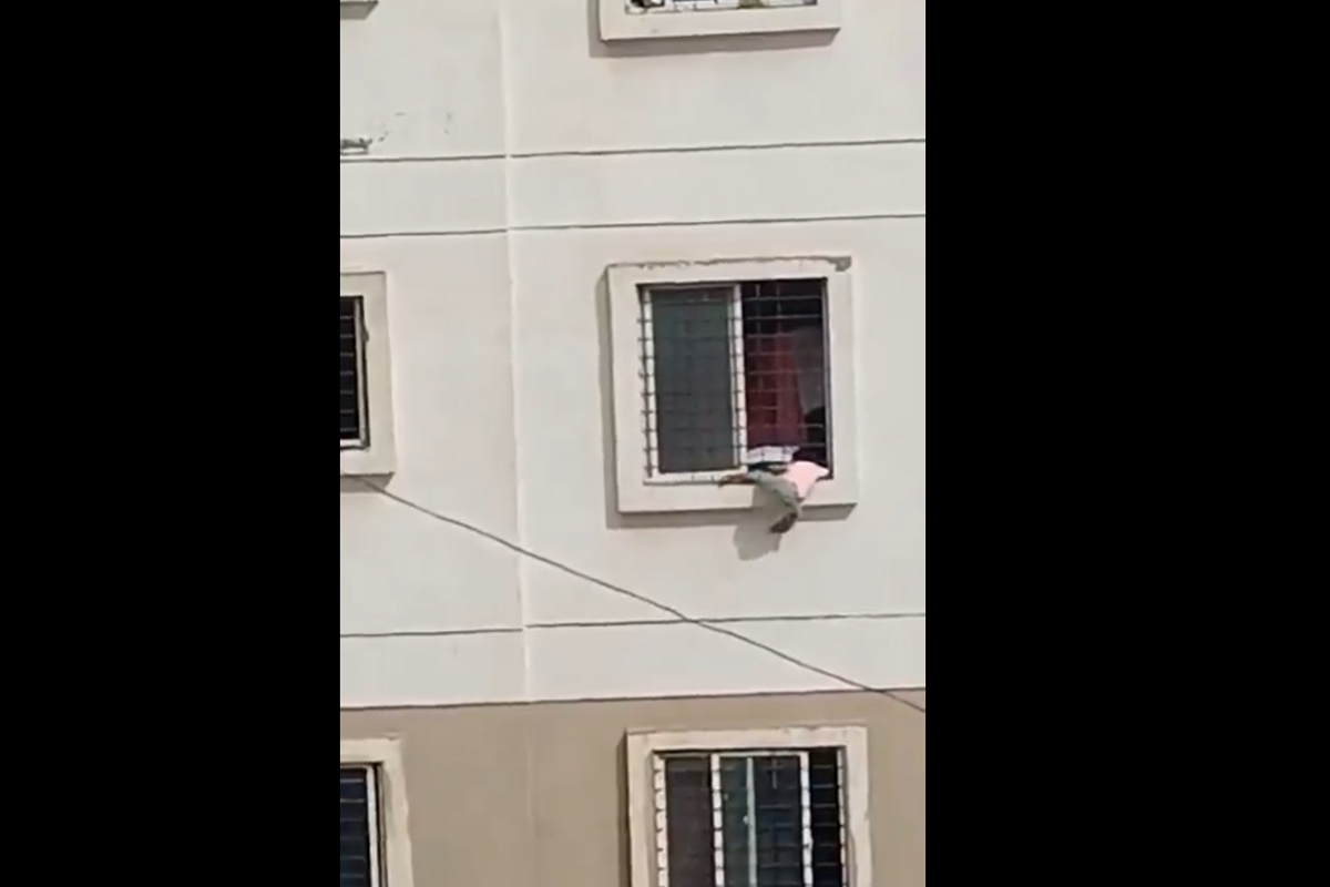 Four-year-old dangling from third-floor window rescued by off-duty firefighter