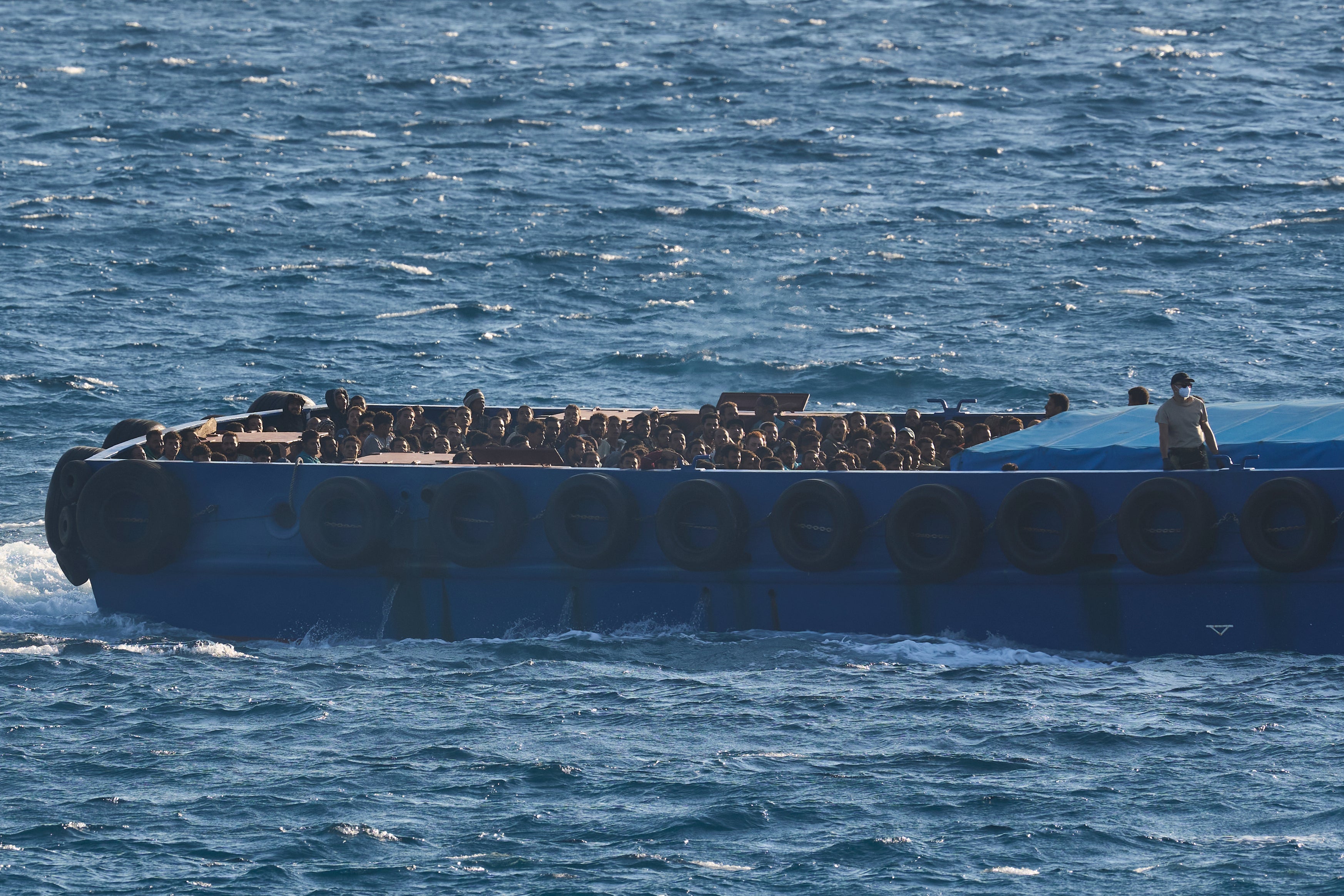 <p>Migrants rescued south of Crete are transferred on a vessel to the port of Lavrio, Greece, on Thursday, July 10, 2025. (AP Photo/Petros Giannakouris)</p>