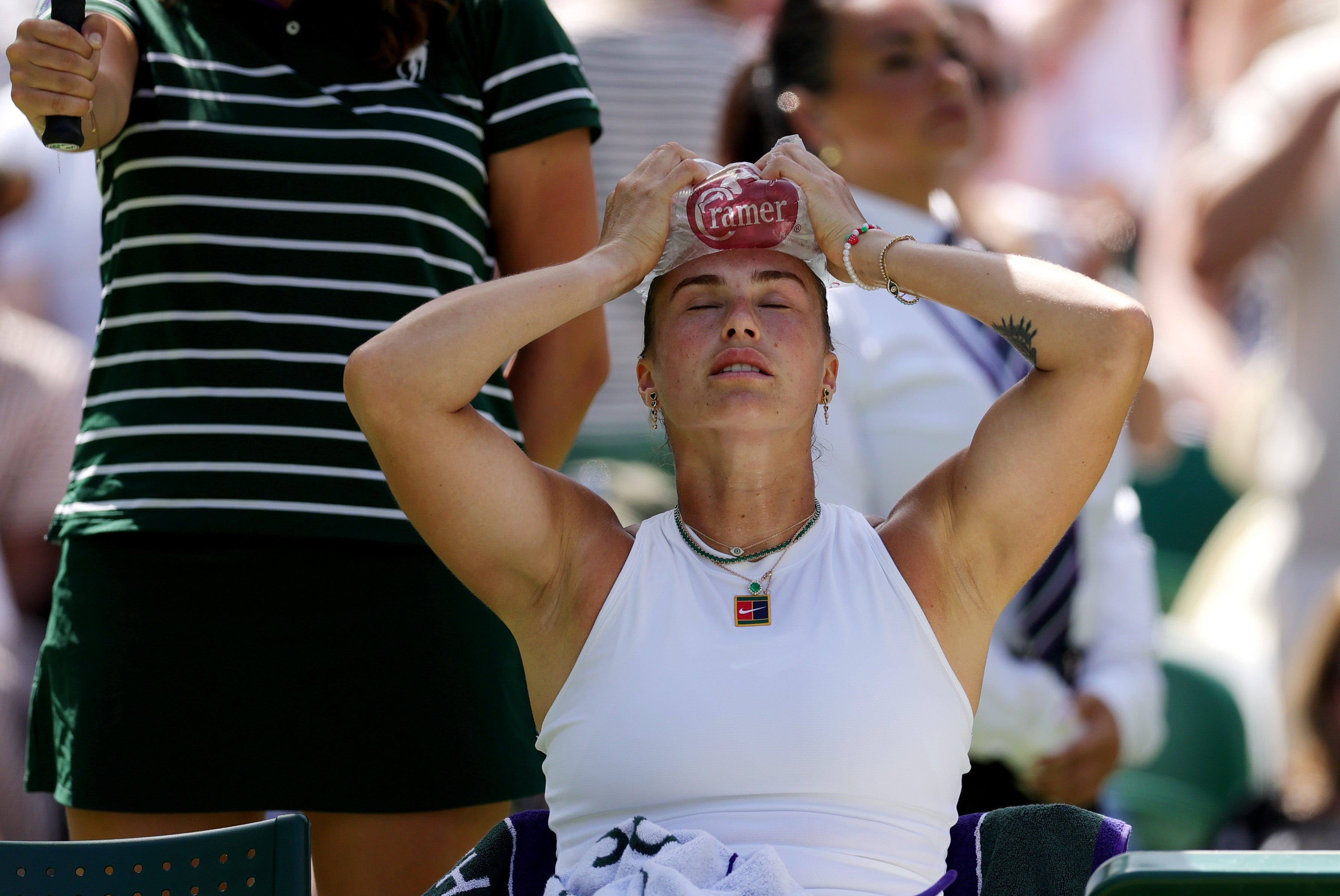 <p>Aryna Sabalenka holds ice on her head amid her semi-final against Amanda Anisimova</p>
