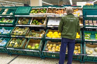 A member of staff at work in Tesco