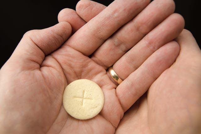 The Church of England said it is considering the case of people who cannot have gluten or alcohol and their participation in holy communion (Alamy/PA)
