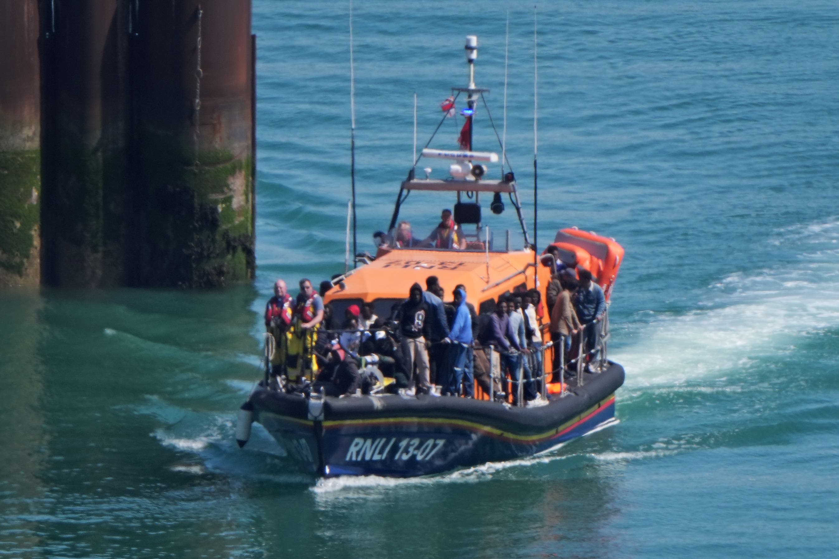 A group of people thought to be migrants are brought in to Dover, Kent, onboard an RNLI Lifeboat. (Gareth Fuller/PA)