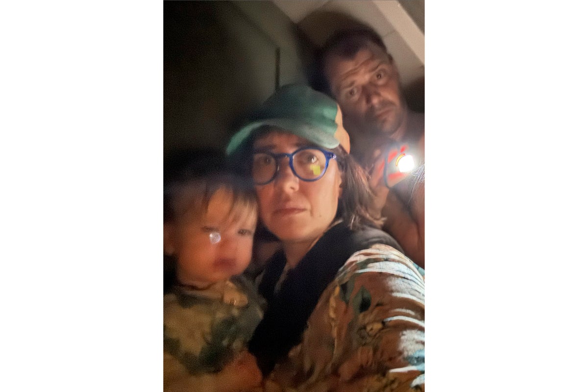 A Texas family clung to life on their roof, capturing the terrifying flooding in photos and video