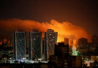 An explosion of a drone lights up the sky over the city during a Russian drone and missile strike in Kyiv