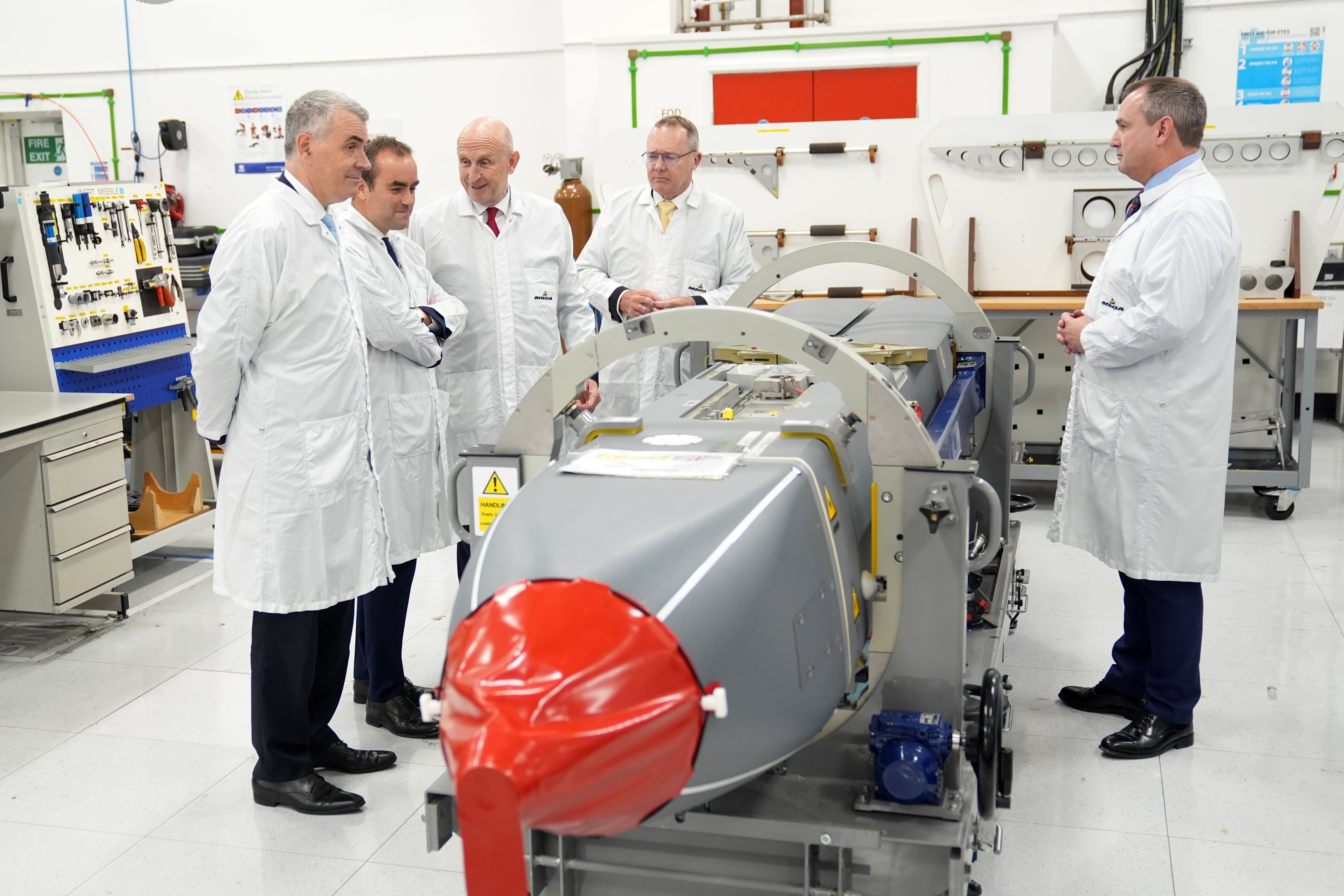 Defence Secretary John Healey (third left) and his French counterpart Sebastien Lecornu (second left), are accompanied by French Managing Director of MBDA, Stephane Reb (left) and Managing Director of MBDA UK, Chris Allam (second right), as they view a long-range air-launched Storm Shadow cruise missile, during a visit to MDBA in Hertfordshire. Picture date: Wednesday 9 July 2025