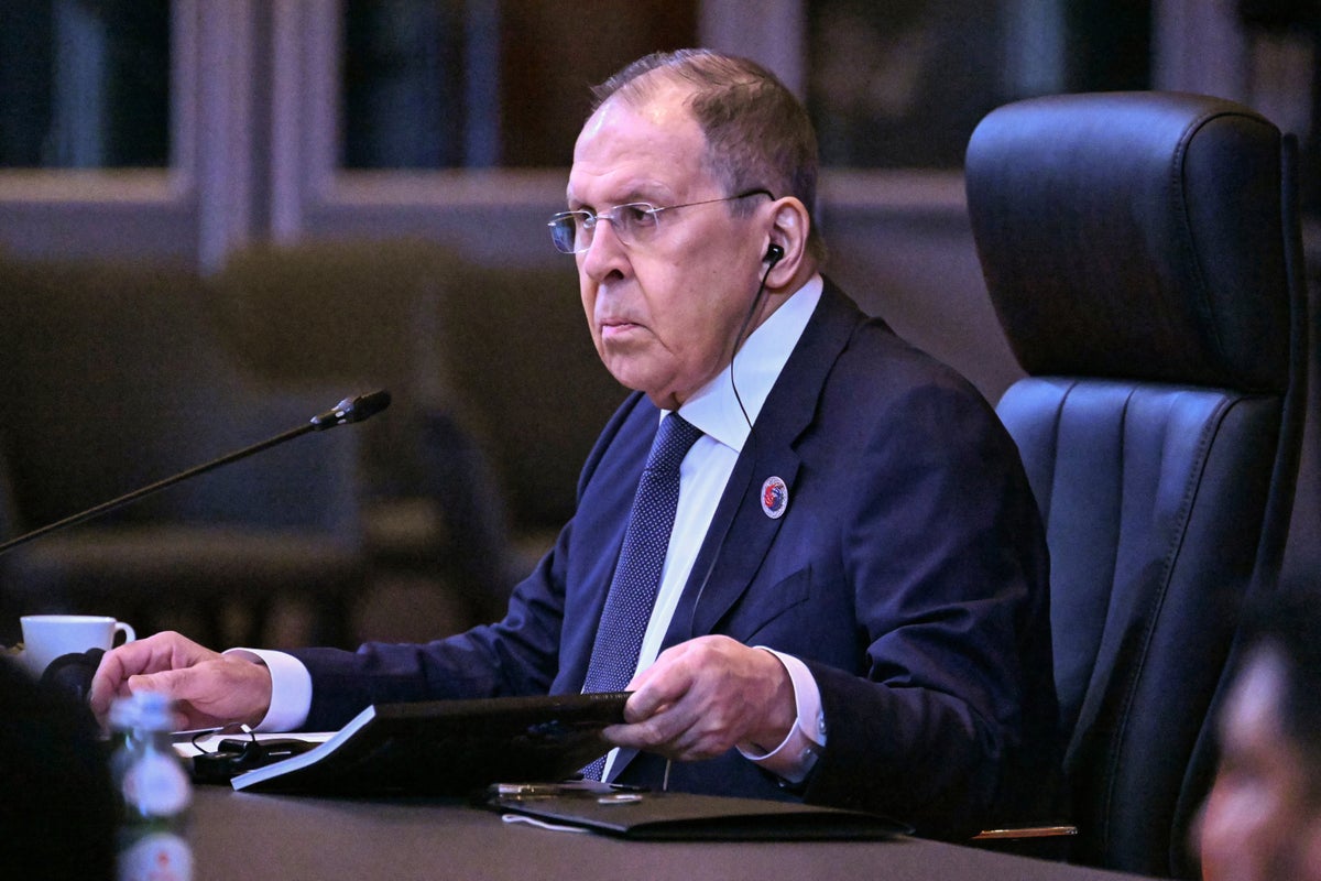 Russian foreign minister wears USSR jumper as he arrives at Trump-Putin summit in Alaska