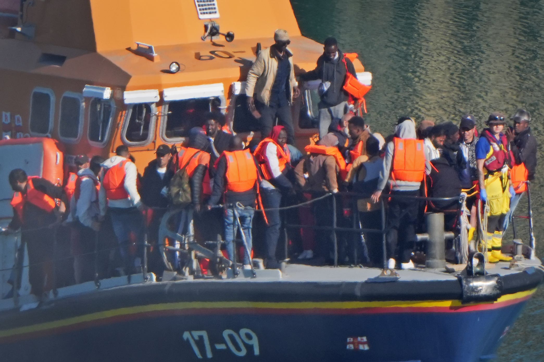 A group of people thought to be migrants are brought in to Dover (Gareth Fuller/PA)