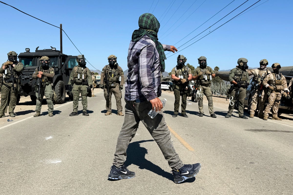 Protesters and federal agents clash during raid at Southern California farm
