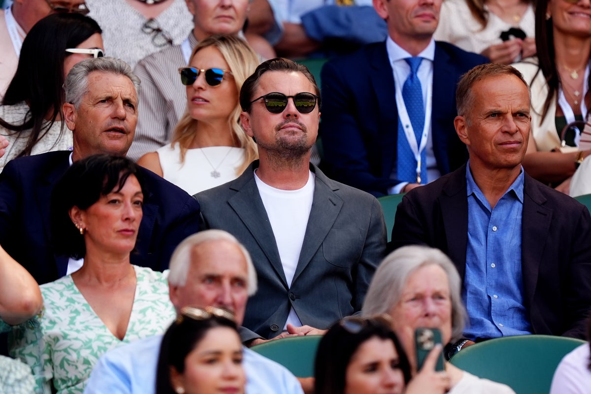 Leonardo DiCaprio laughs with Wimbledon spectators in Royal Box