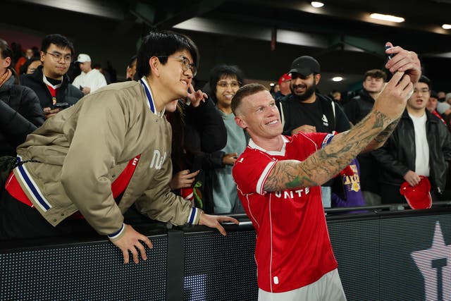 <p>Wrexham captain poses with a fan in Melbourne</p>