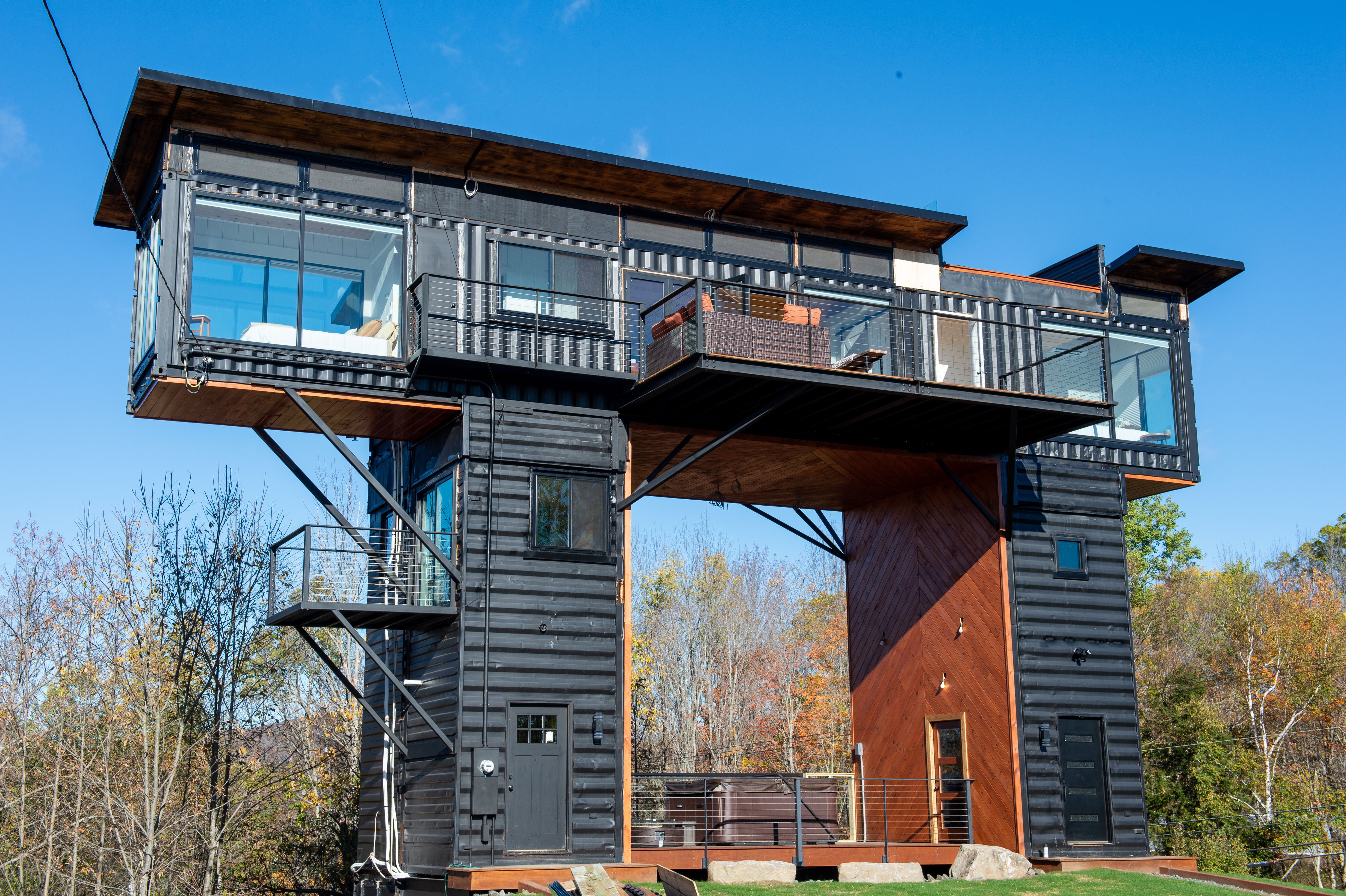 This home is spread across eight shipping containers, with guests sleeping in three master bedrooms that have 'amazing panoramic views'
