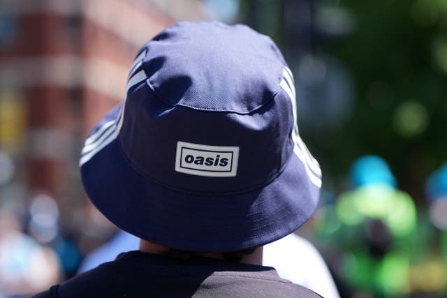 <p>Oasis fans gather in Manchester City centre ahead of the show</p>