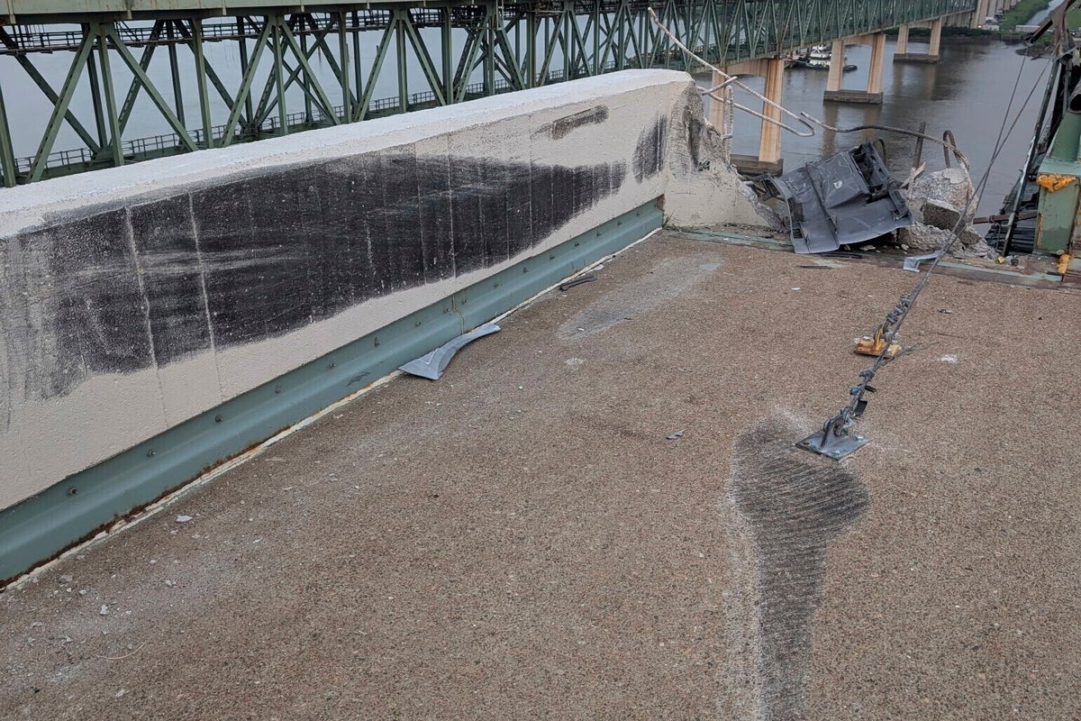 Truck smashes through barrier and plunges off a bridge into the Delaware River