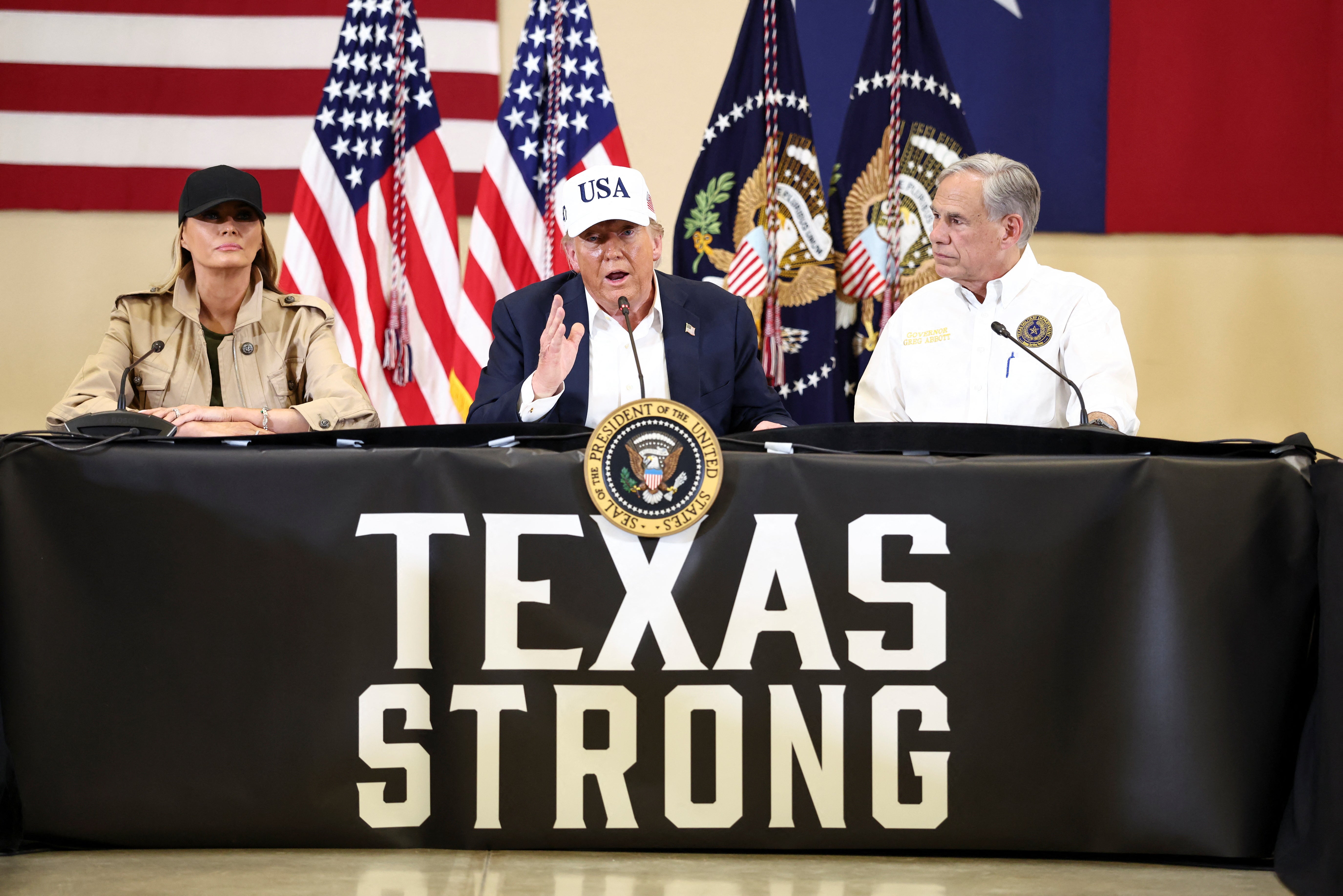 President Donald Trump, first lady Melania Trump and Texas Governor Greg Abbott participate in a roundtable with first responders and local officials after catastrophic floods, at Hill Country Youth Center, in Kerrville, Texas