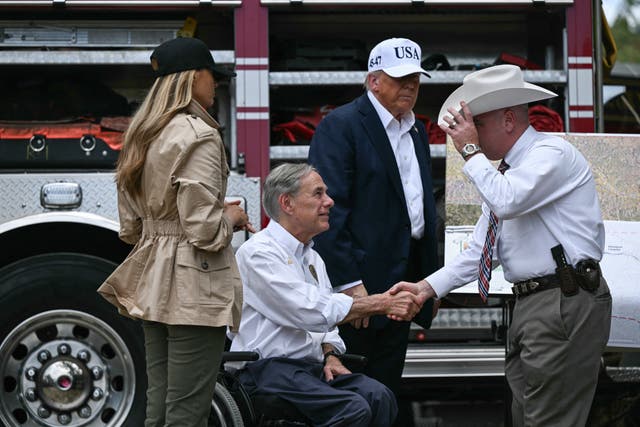 <p>Donald Trump, First Lady Melania Trump and Texas Governor Greg Abbott meet with local officials and first responders in Kerrville, Texas on Friday</p>
