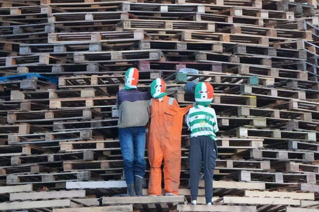 Effigies of the Irish rap group Kneecap on a loyalist bonfire in south Belfast on Friday night, (Niall Carson/PA)