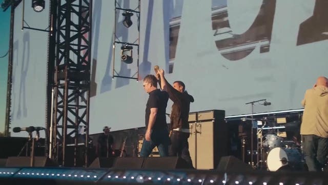 <p>Oasis brothers Liam and Noel Gallagher walk hand-in-hand to kick off first night at Manchester’s Heaton Park.</p>