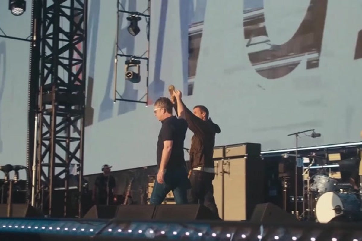 Oasis brothers Liam and Noel Gallagher walk hand-in-hand to kick off first night at Manchester’s Heaton Park