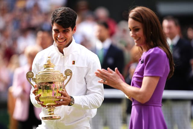 <p>Carlos Alcaraz (left) is presented with the trophy by the Princess of Wales after victory in 2024 (Aaron Chown/PA)</p>