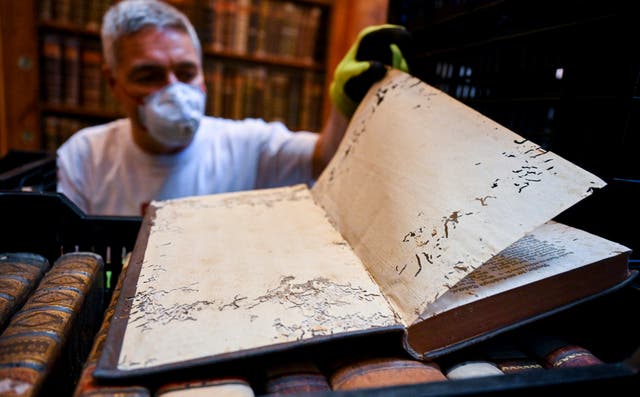 <p>Damage to a book at Pannonhalma Archabbey</p>
