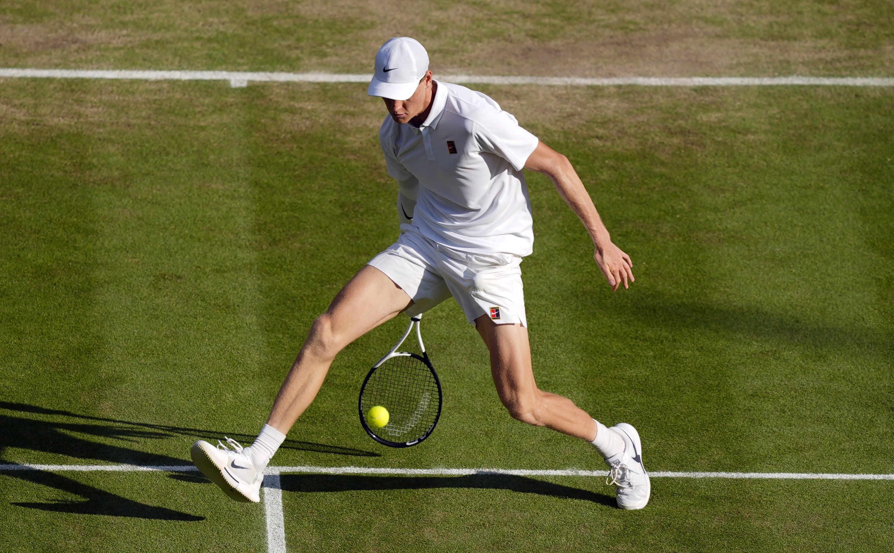 Sinner plays a tweener volley (Jordan Pettitt/PA)