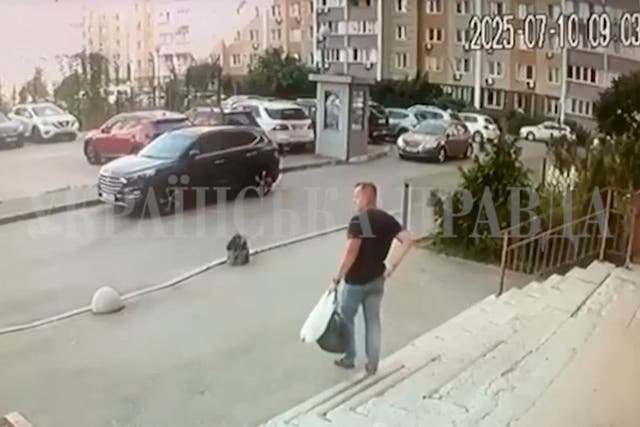 <p>CCTV footage shows a Security Service of Ukraine officer walking down the stairs moments before he was shot in Kyiv on Thursday. He has since been identified as Colonel Ivan Voronych</p>