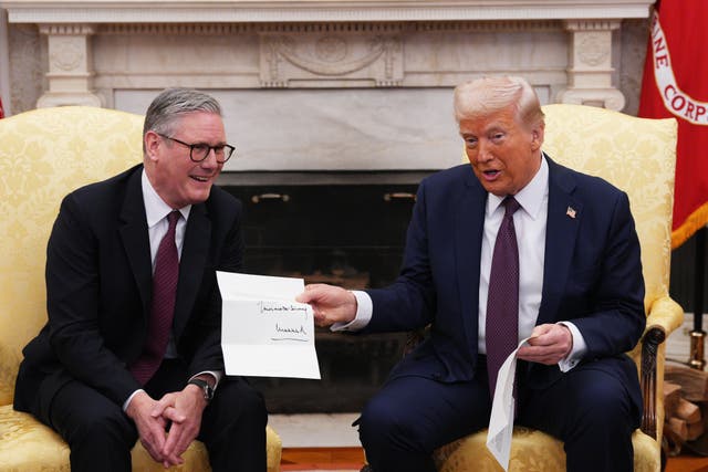 <p>Mr Trump was presented with a letter from the King regarding his second state visit by the Prime Minister in February (Carl Court/PA)</p>