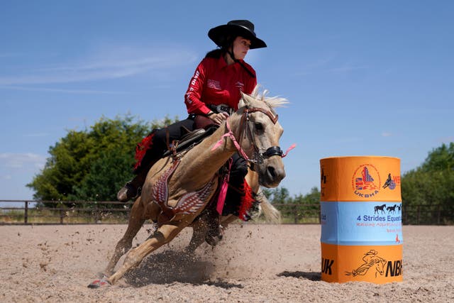 Barrel racer Eloisa Atkinson, 15, on her pony Peaches during a training session at 4 Strides Equestrian UK in Fulbeck, Lincolnshire (Joe Giddens/PA)