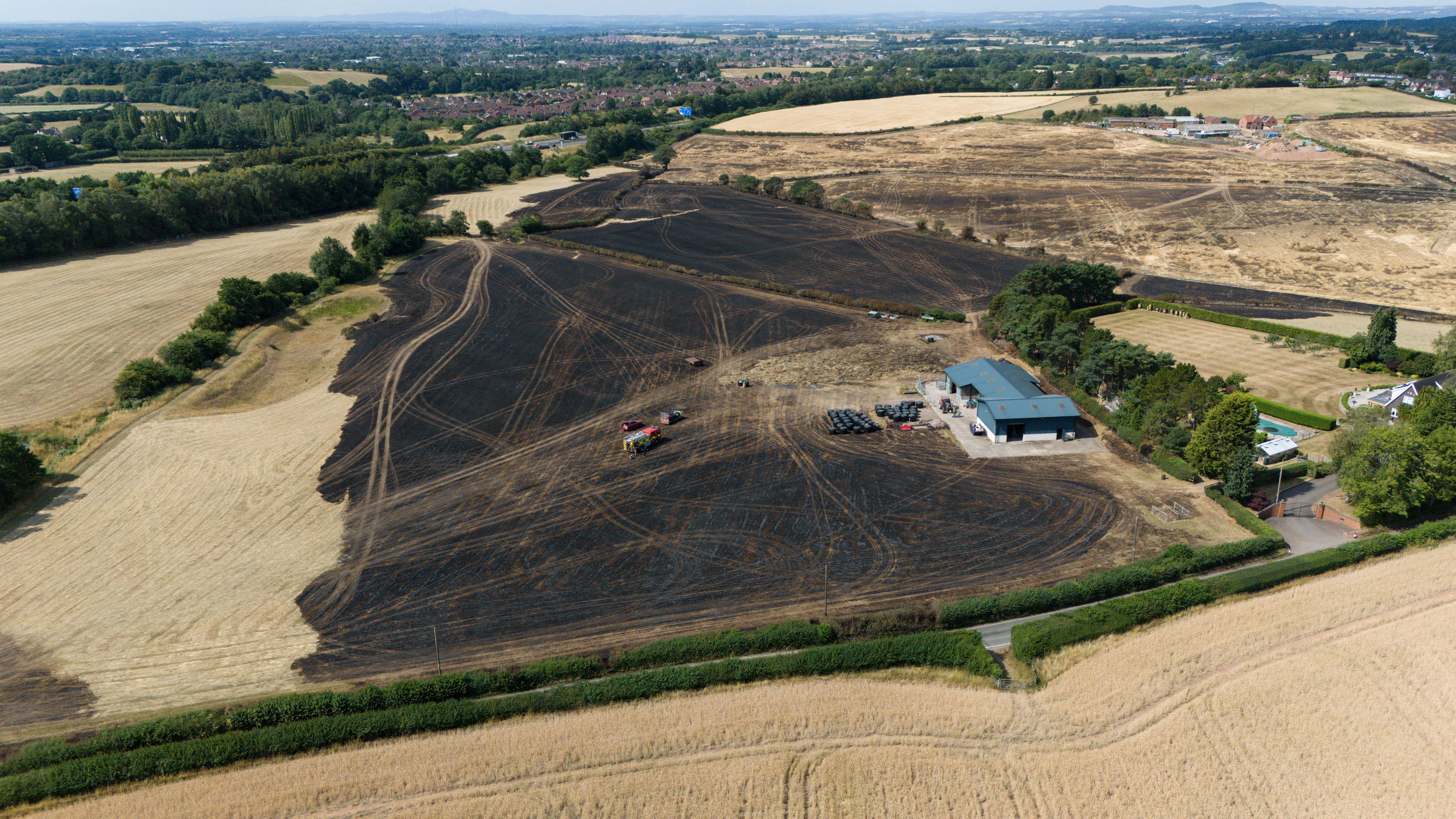 A torched field in Marlbrook, Worcestershire, after homes were evacuated following a fire on Saturday evening